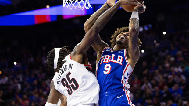 Philadelphia 76ers guard Kelly Oubre Jr. is fouled by Portland Trail Blazers center Robert Williams III